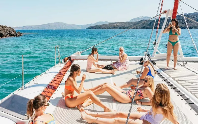 Catamaran Tour with BBQ Dinner, Drinks, and Music — boat tours and day cruises from Santorini, Greece