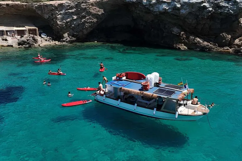 Ibiza by Sea: Coves, Caves, Water Sports & Open Bar — a boat tour from Ibiza, Spain
