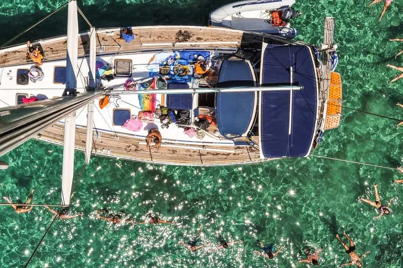 Day-cruise boats at Adamas harbour on a boat tour from Milos, Greece