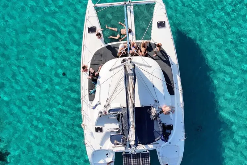From Ornos: Mykonos Delos Catamaran Cruise with Meal & SUP — a boat tour from Mykonos, Greece