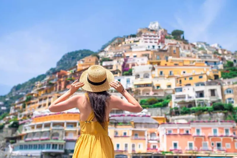 Day-cruise boats at Spiaggia Grande jetty on a boat tour from Positano, Italy