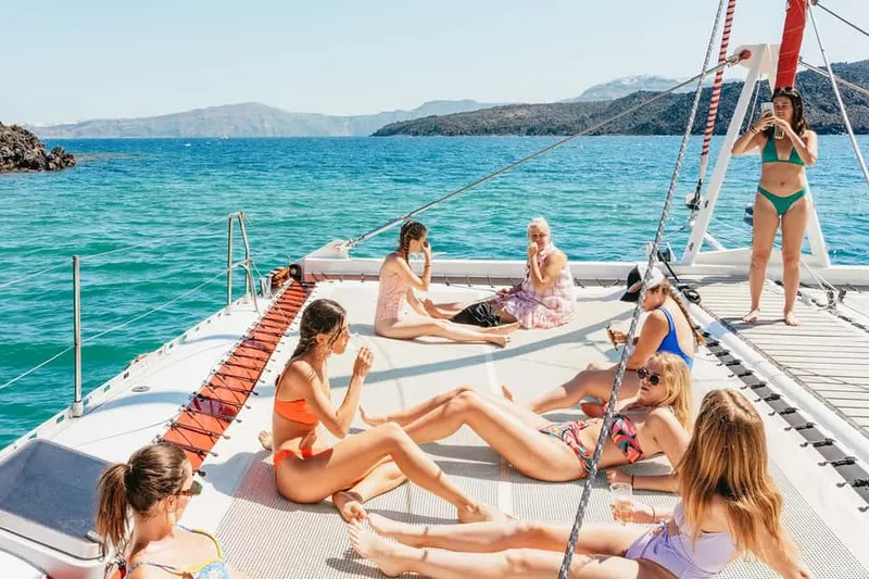 Day-cruise boats at Ammoudi & Vlychada on a boat tour from Santorini, Greece
